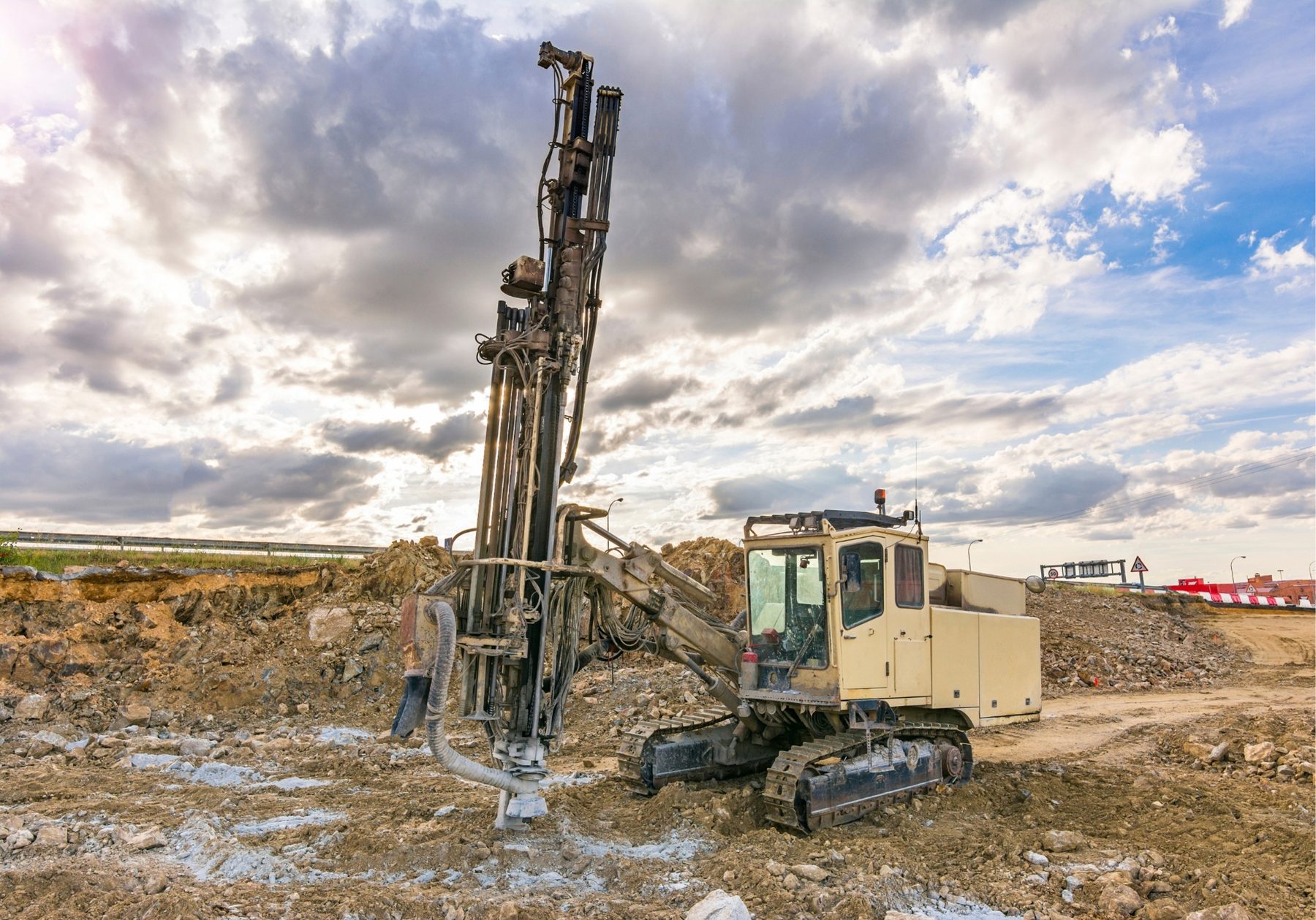 MMST drill rig working on an open ridge under clear sky in East Africa